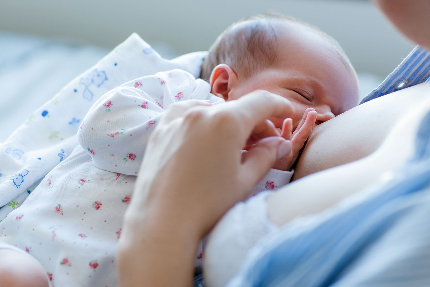 A mum breastfeeding her newborn